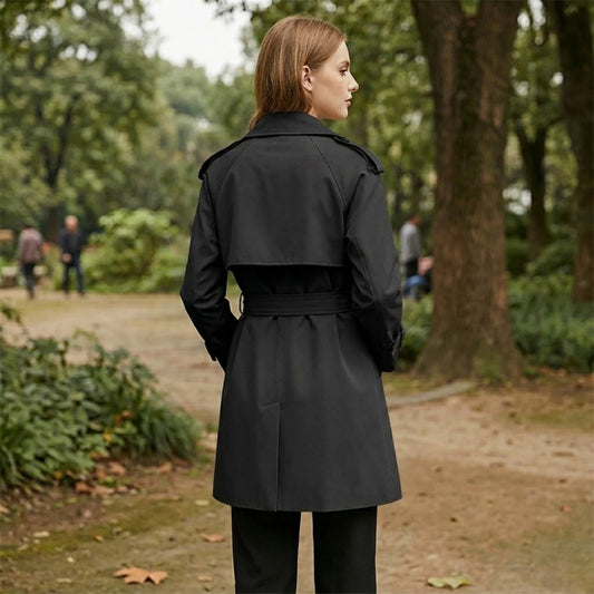 Women's mid-length trench coat – an elegant windbreaker coat with double-breasted closure and belt.